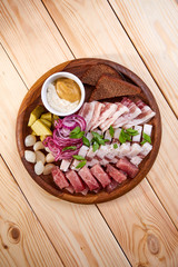 meat appetizer on the wooden background