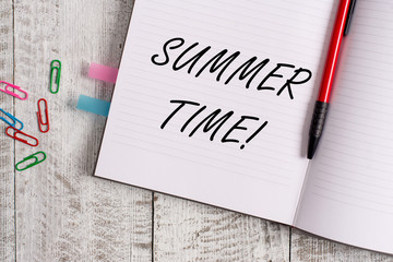 Conceptual hand writing showing Summer Time. Concept meaning achieve longer evening daylight summer setting clocks hour ahead Notebook stationary placed above classic wooden backdrop