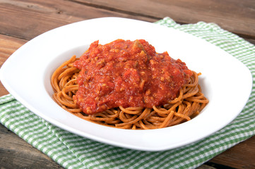 plain cooked spaghetti pasta no topping over a wood table