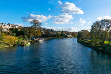 South-facing view of the Thames from Richmond Bridge in London, England during the summer.