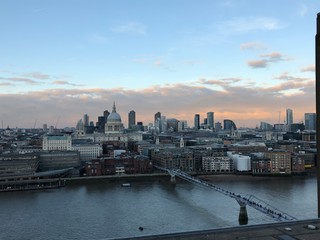 Fototapeta premium Panoramic aerial view at sunset across the City of London and the Thames river 
