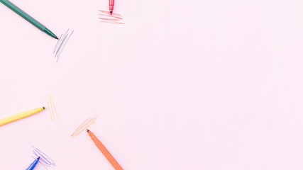 Marker pens near bright strokes