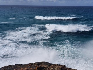waves crashing on rocks