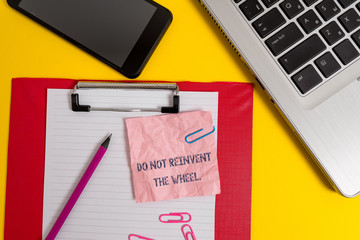 Word writing text Do Not Reinvent The Wheel. Business photo showcasing stop duplicating a basic method previously done Laptop clipboard sheet clips pencil note smartphone colored background