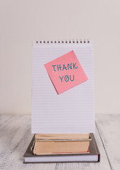 Writing note showing Thank You. Business concept for a polite expression used when acknowledging a...