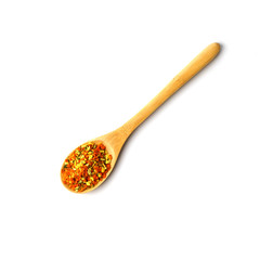 wooden spoon with spices of dry herbs and vegetables