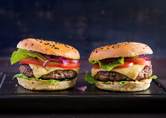 Big sandwich - hamburger burger with beef,  tomato,  cheese and lettuce.