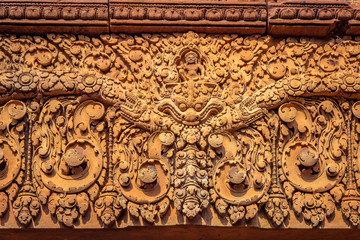 Ornate bas-relief on the exterior of the temples of Banteay Srei in Siem Reap, Cambodia.