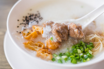 Thai style rice boiled with pork in bowl