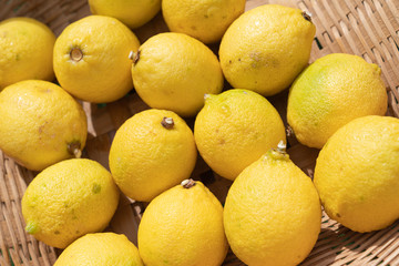 Close up lemon setting in basket in natural light scene / food material / food background / raw material / food photography