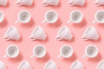 Coffee cup pattern on pink background