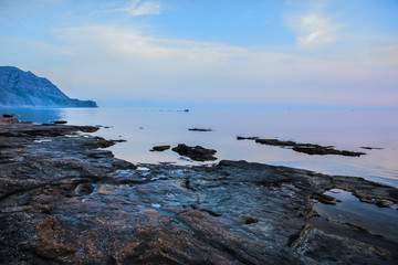 Sea beach with a cape