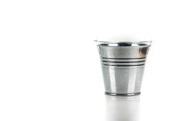 Small galvanized bucket on white background.