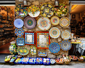 Street exhibitions of goods - from huge dishes to tiny souvenirs - serve as an attractive tradition...