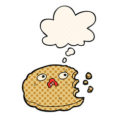 cartoon bitten cookie and thought bubble in comic book style