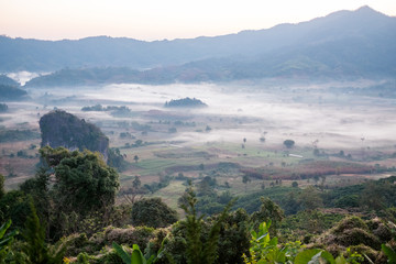Fototapeta premium Scenic mountain landscape and fog on the hill in Phu Lung ka in Phayao province, Thailand