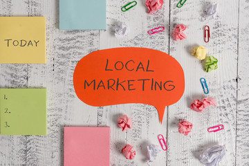 Word writing text Local Marketing. Business photo showcasing A local business where a product buy and sell in area base Blank speech bubble paper balls clips sticky notes old wooden background
