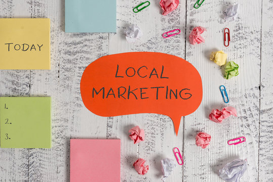 Word writing text Local Marketing. Business photo showcasing A local business where a product buy and sell in area base Blank speech bubble paper balls clips sticky notes old wooden background