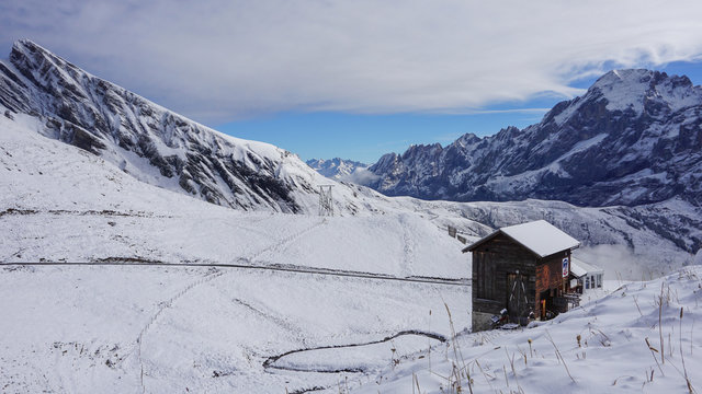 Traditional wooden houses on the mountainside in Grindelwald, Switzerland.
