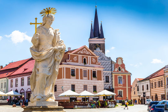 Main square of Telc city, a UNESCO World Heritage Site, on a sunny day with blue sky and clouds, South Moravia, Czech Republic.