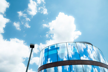 Blue sky reflection on glass building
