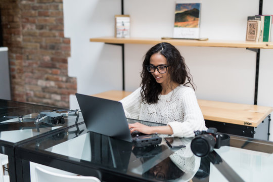 Businesswoman entrepreneur working on laptop from home office space