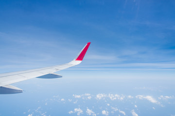 Fototapeta premium aircraft Wing on cloudscape and blue sky