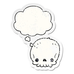 cartoon skull and thought bubble as a distressed worn sticker