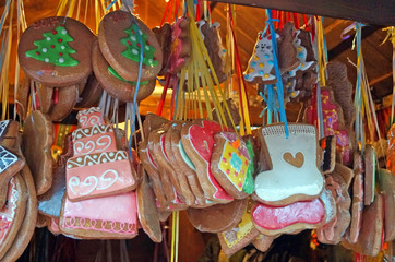 Christmas gingerbread cookies of different shapes coated with icing in different colors on the Christmas market