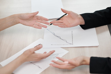 Close-up desktop. Tablet, charts and documents. The concept of team office work. Women at work.