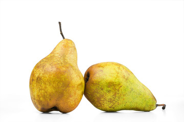 Two ripe pears are isolated on a white background.