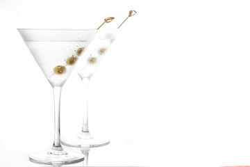 Classic Dry Martini with olives isolated on white background. Copyspace