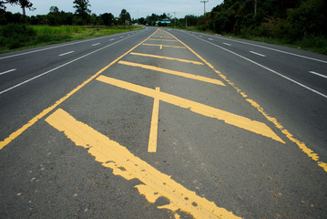 Obraz premium Road traffic paint Yellow on the asphalt surface