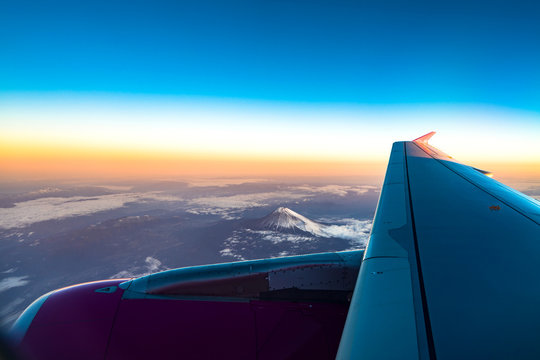 clouds sky skyscape and fuji mountain. Sunrise view from the window of an airplane flying in the clouds, top view clouds like the sea of clouds sky background, Aerial view background, Yamanashi, Japan