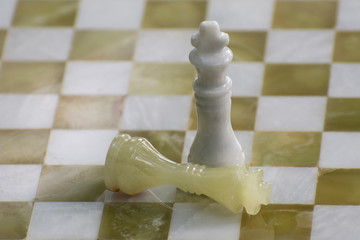 Two chess pieces on the board - a symbol of victory in the game. Dedicated to International Chess...