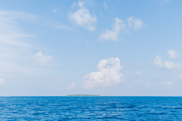 Naklejka na ściany i meble Calm Sea and Blue Sky Background in Maldives