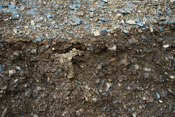 Stone mixed soil is used to repair roads.