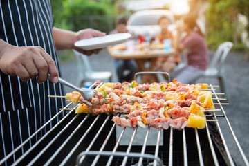 Barbeque Grill Street Food in thailand,Eat outdoors in a happy family. holiday celebration concept