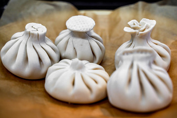 Khinkali, Georgian dumplings, traditional Georgian cuisine. Khinkali on a plate side view.
