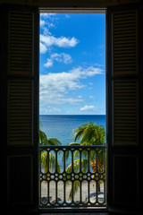 Fototapeta premium view from the balcony on Caribbean ocean with palms trees on Martinique Island