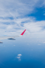 aircraft Wing on cloudscape and blue sky