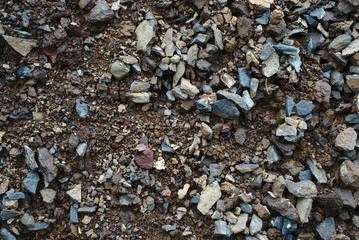 Stone mixed soil is used to repair roads.