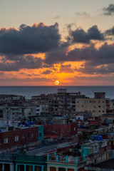 Aerial view of the residential neighborhood in the Havana City, Capital of Cuba, during a colorful sunset.