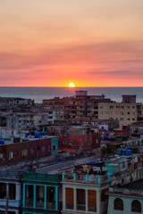Fototapeta premium Aerial view of the residential neighborhood in the Havana City, Capital of Cuba, during a colorful sunset.