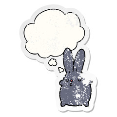 cute cartoon rabbit and thought bubble as a distressed worn sticker