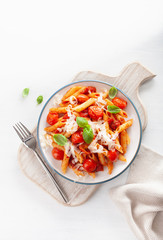 italian penne pasta with tomatoes parmesan basil
