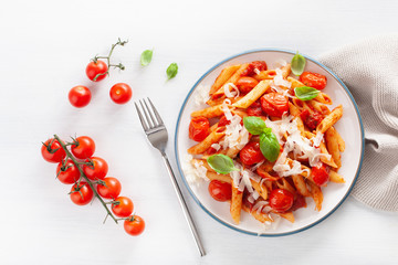 italian penne pasta with tomatoes parmesan basil