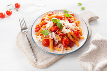 italian penne pasta with tomatoes parmesan basil