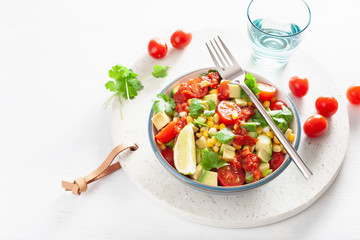 healthy vegan avocado sweetcorn tomato salad