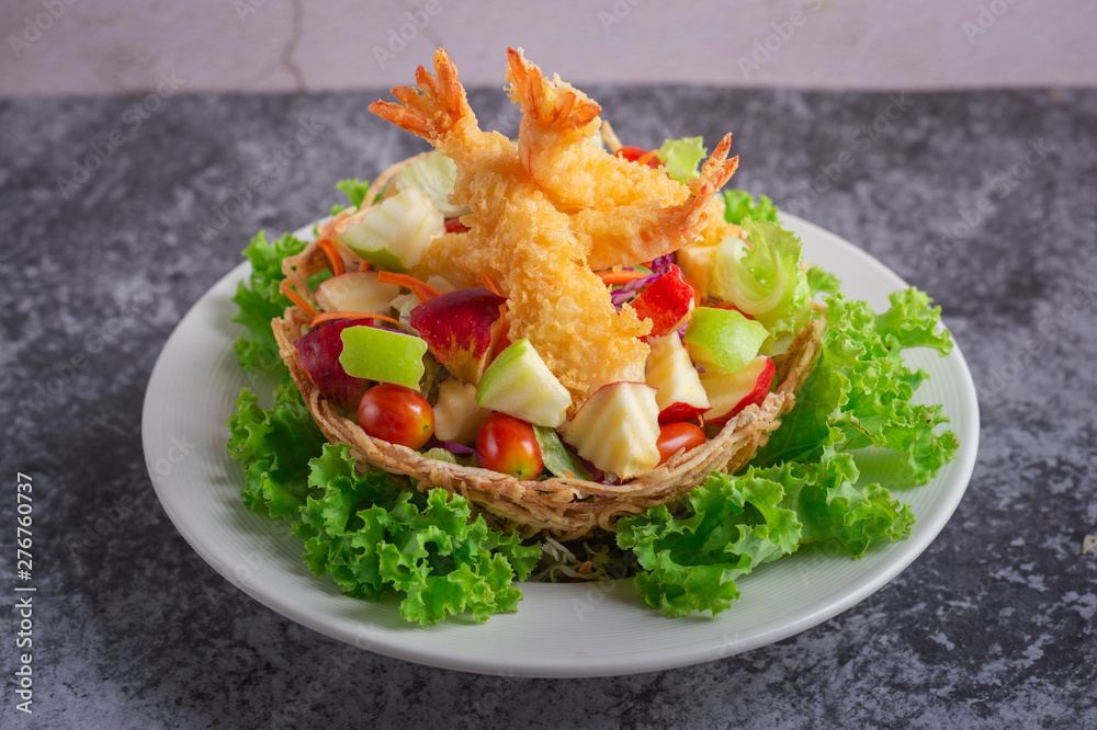 Wall mural Tempura Jumbo Shrimps with salad and salsa dip on white plate